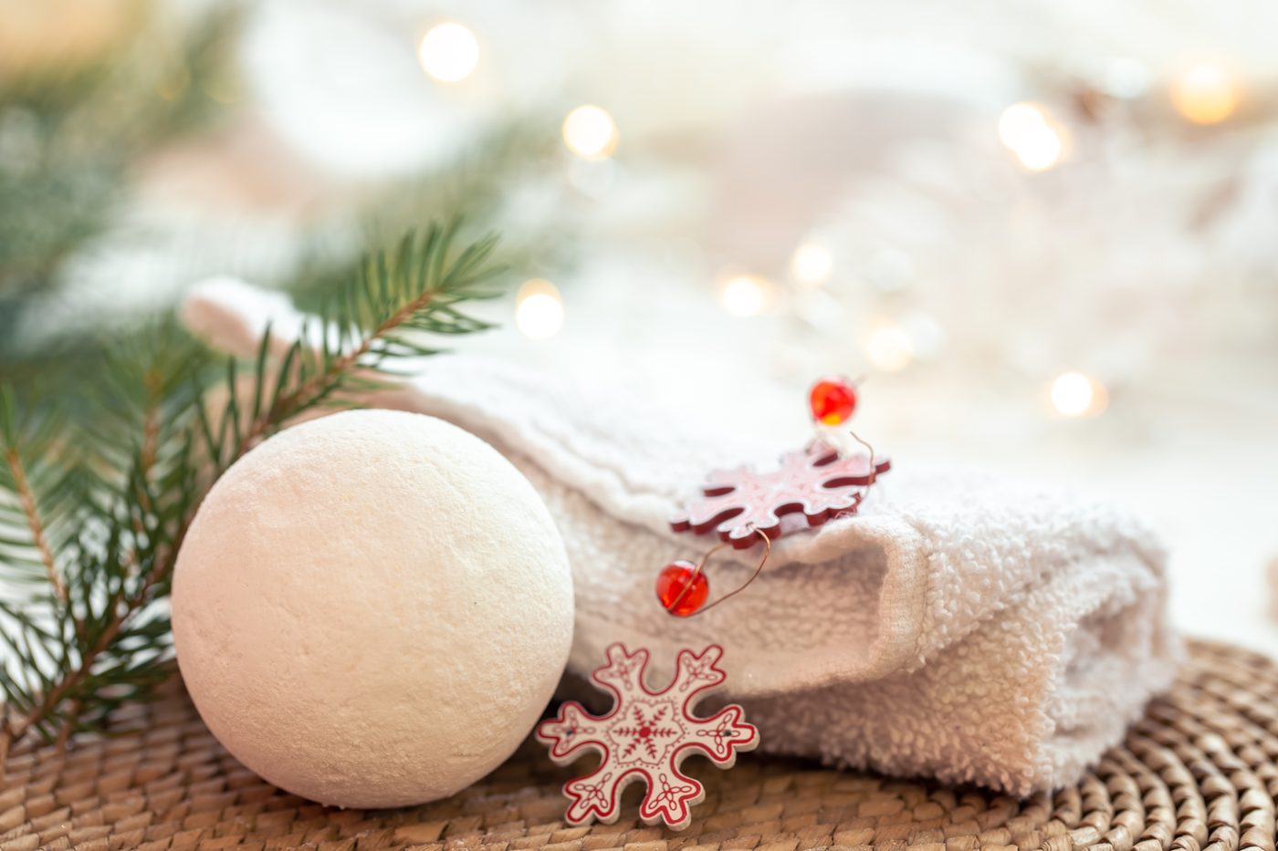Rolled spa towel, bath bomb and pine sprigs for a festive December visit to Skin & Beauty Box in Bristol